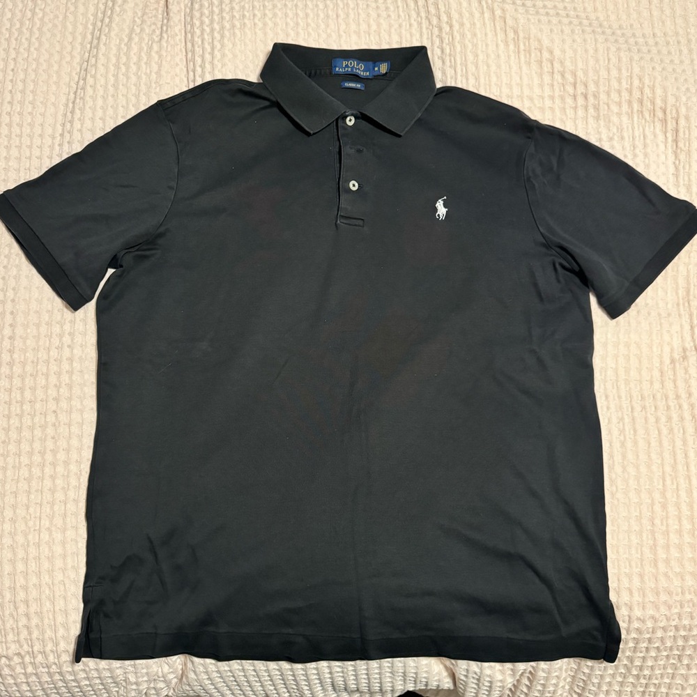 Lightly used black Polo shirt. No tears, stains or irregularities.